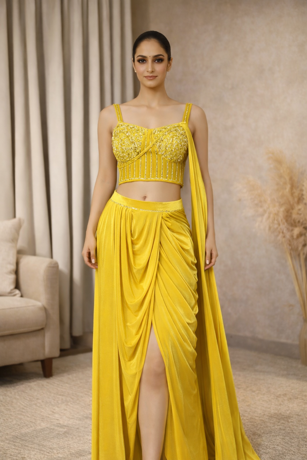 Woman wearing a yellow saree with handwork blouse