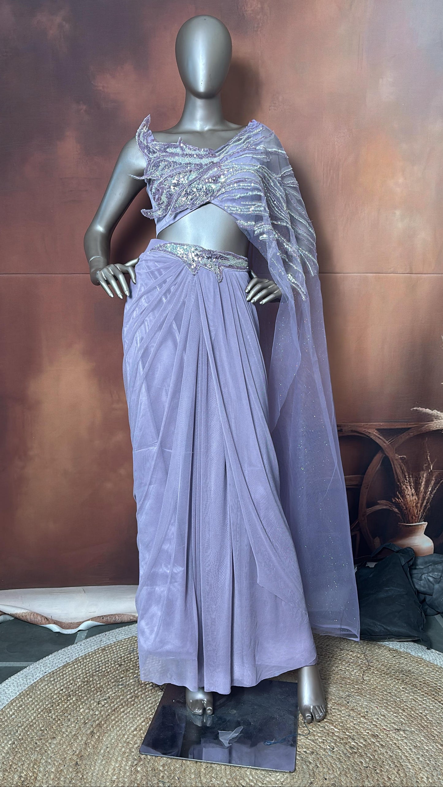 A lavender saree with a handwork blouse