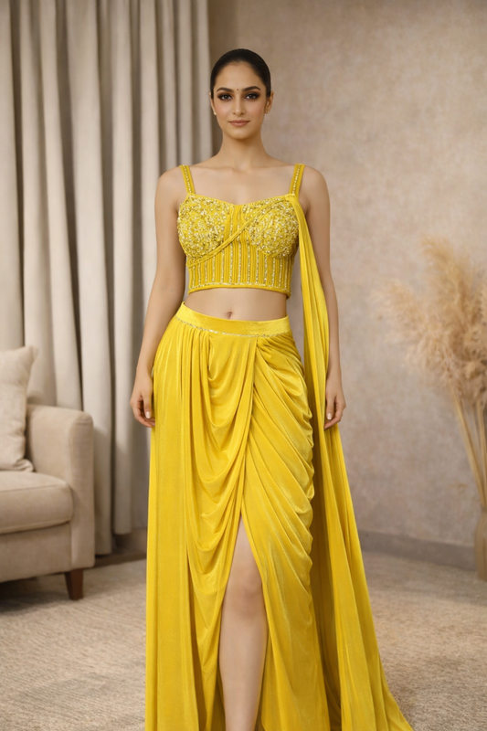 Woman wearing a yellow saree with handwork blouse 